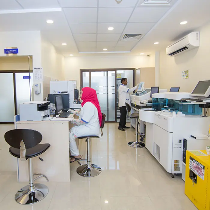 It is an image of a diagnostic lab with a male and female working in it.
