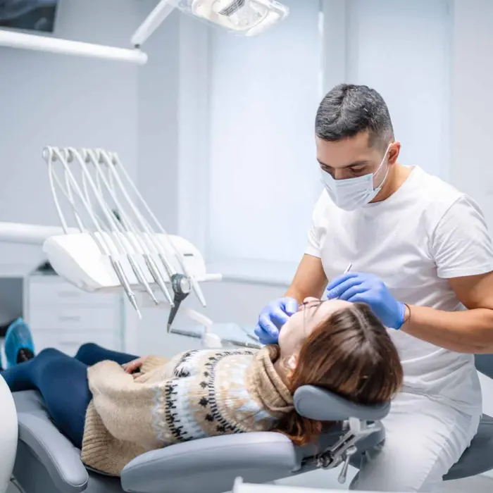It is image of a male dentist creating a female patient.
